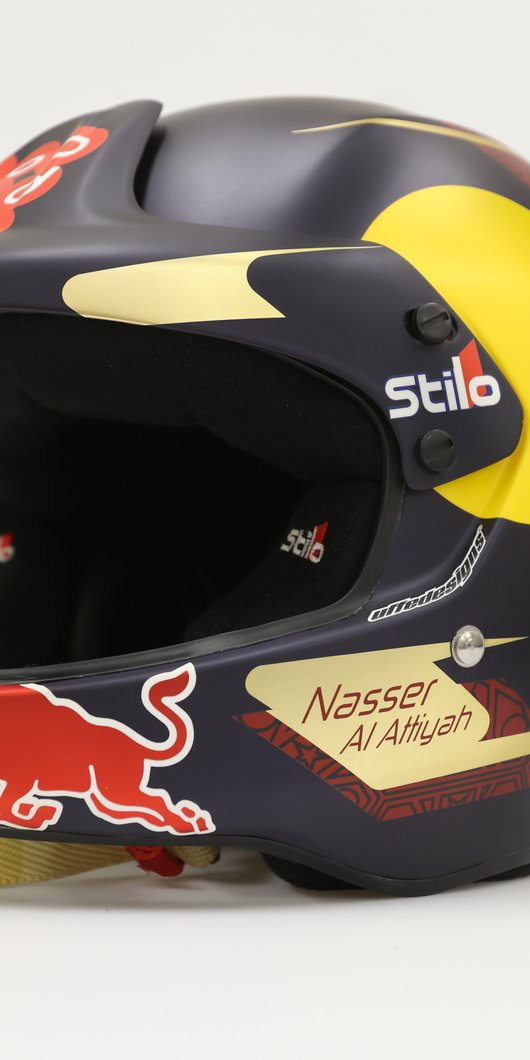 A race helmet with the name Nasser Al Attiyah stapled to its side