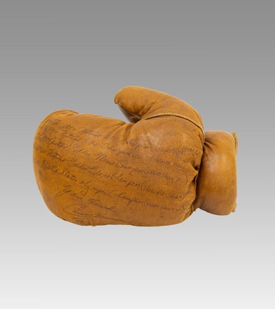 Boxing glove (left hand), 1960 Signed by Cassius Clay (Muhammad Ali)