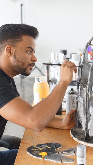 Artist in residence Mohammed Faraj Al-Suwaidi working in his studio at the Fire Station.