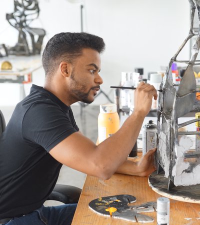 Artist in residence Mohammed Faraj Al-Suwaidi working in his studio at the Fire Station.