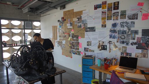 Artist Nourbanu Hijazi working in her studio at the Fire Station.