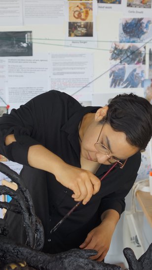 Nourbanu Hijazi working in her studio.