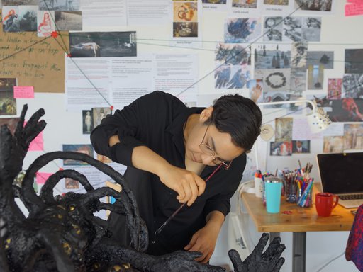 Nourbanu Hijazi working in her studio.