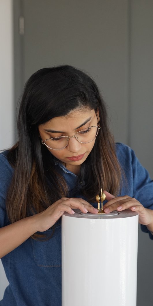 Sidra Zubairi working in her studio.