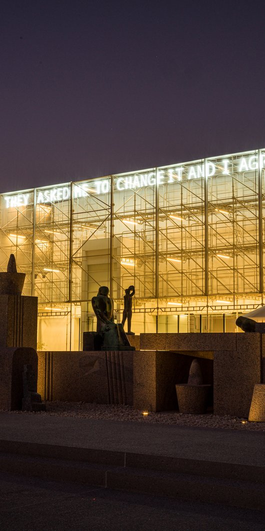 Neon light installation on outside the Mathaf museum building