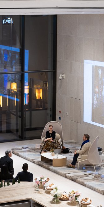 Top view of a talk with two speakers and audience.