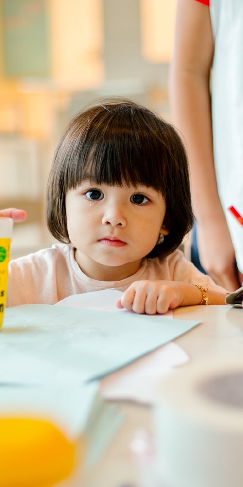 A young child in a classroom