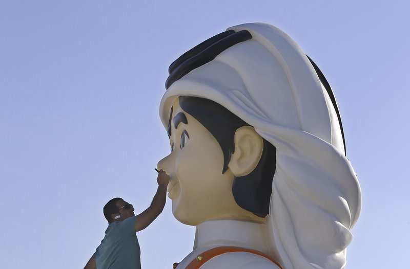 artist painting a sculpture