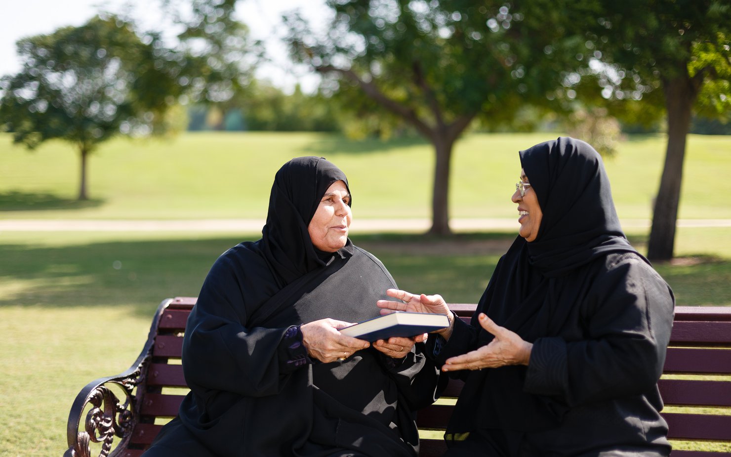 Two women having a discuss about a book