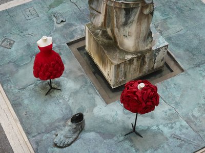 Two dresses and a sculpture