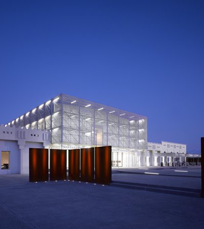 Exterior of Mathaf: Arab Museum of Modern Art lit up at night