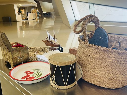 Set of traditional Qatari household objects placed on a table