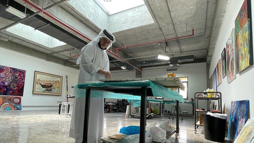 Ruwad Artist Hassan Al-Mulla working in his studio at the Fire Station.