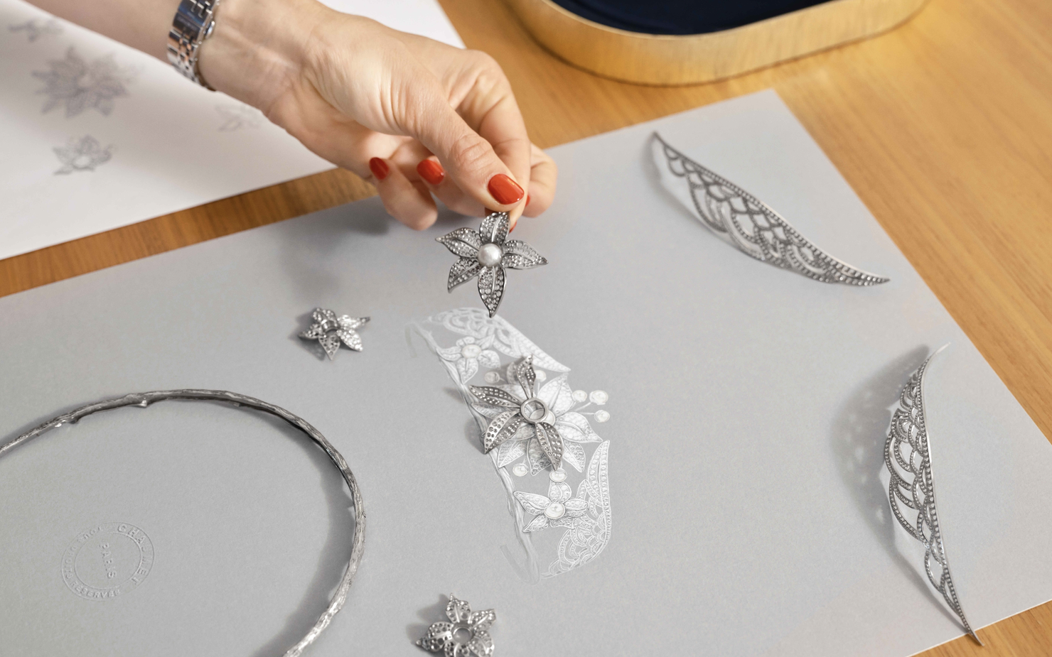 Hand holding a flower jewellery