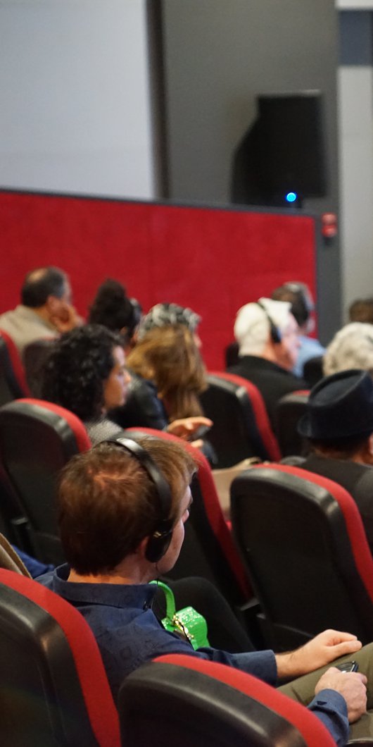 Attendees to a public talk at the Fire Station Cinema.