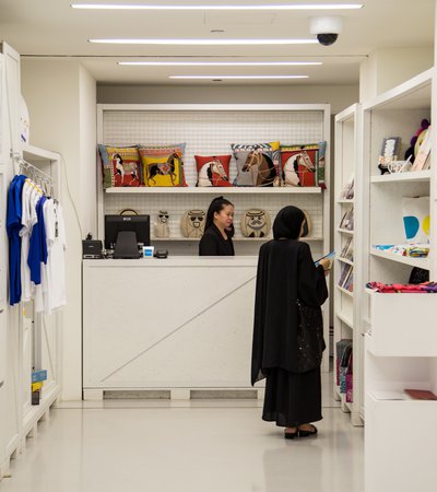 A woman shopping in Mathaf's gift shop