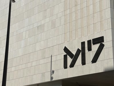 Exterior view of M7's building showing logo signage.