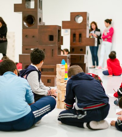 Children playing with building blocks to create towers