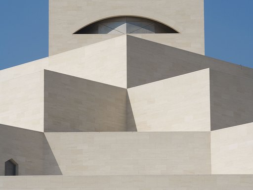 A view of the geometrical, cream-coloured limestone walls of the MIA