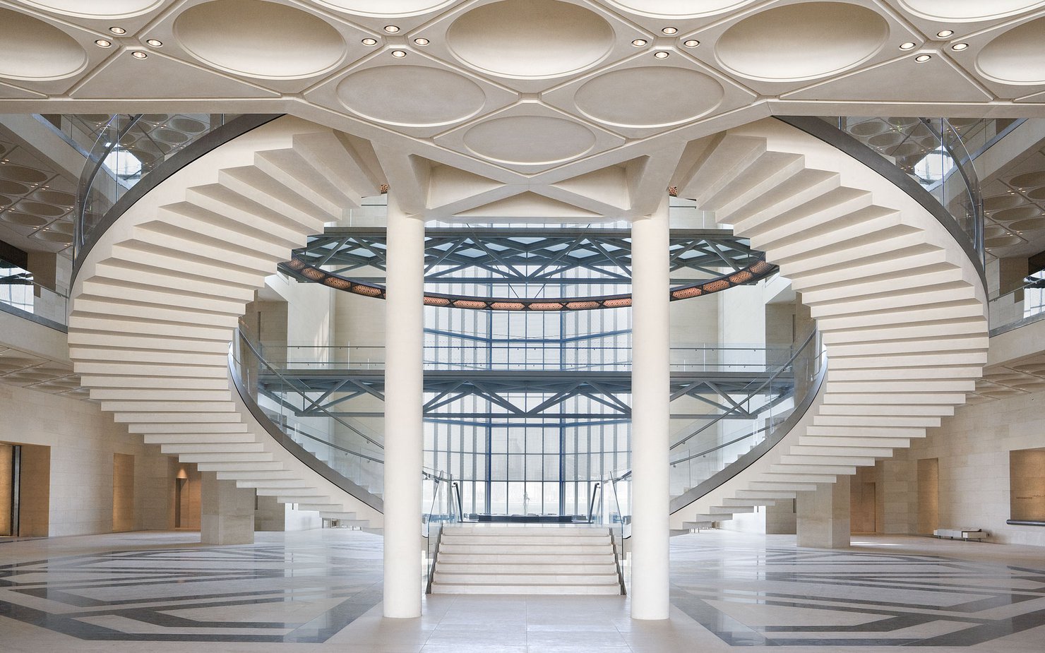 MIA's atrium showing curved staircases, glass walls and engraved ceilings