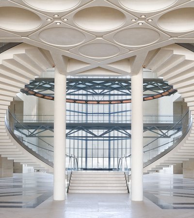 MIA's atrium showing curved staircases, glass walls and engraved ceilings