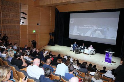 Auditorium in the Museum of Islamic Art filled with audiences while they listen to a conversation with Luc Tuymans