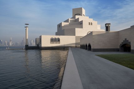 Waterside pathway to the Museum of Islamic Art (MIA) with Doha in the background