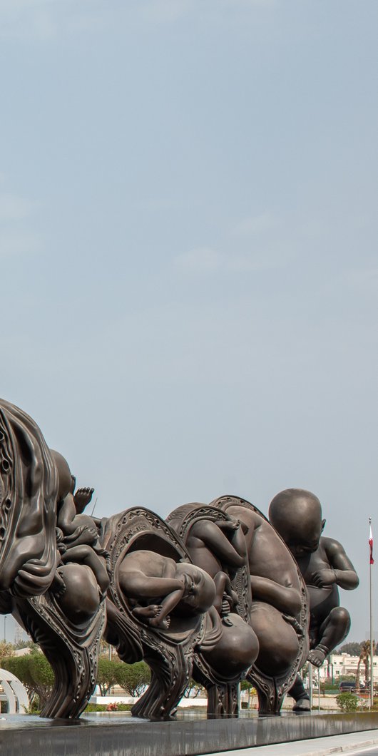 A series of 14 sculptures depicting the human gestational cycle, from conception to birth, located outside Sidra Medicine