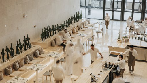 Viewed from above, Profiles café and restaurant with guests and staff.