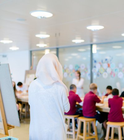 Instructor teaching children at a workshop