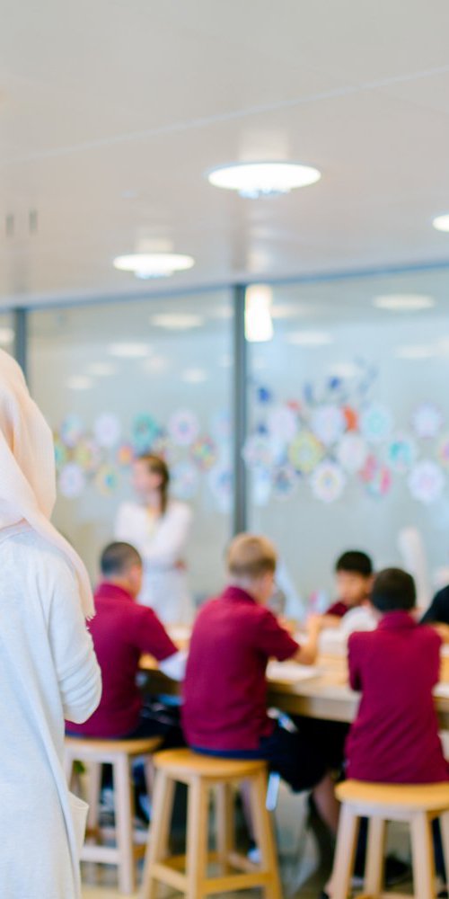 Instructor teaching children at a workshop