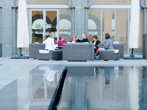 A group of women sitting around a table at the Museum of Islamic Art