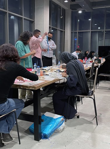 Participants in the workshop “Screen-printing Tote bags” at Fire Station working on their desks in the Education Studio.