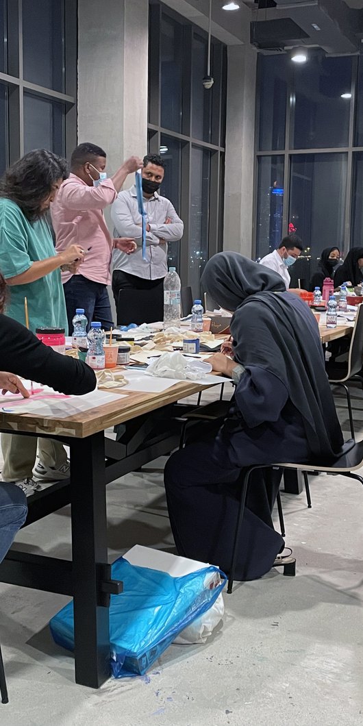 Participants in the workshop “Screen-printing Tote bags” at Fire Station working on their desks in the Education Studio.