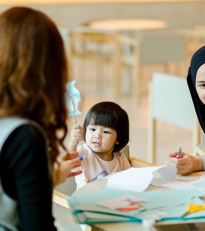 A mother and her child attend a workshop